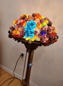 This is a fruite bowl style lamp with a brass bowl and pedestal base.