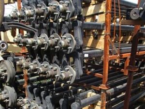 Metal Stand With Large Group of Trailer Axles